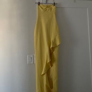 Likely light yellow summer strapless spring gown with ruffle